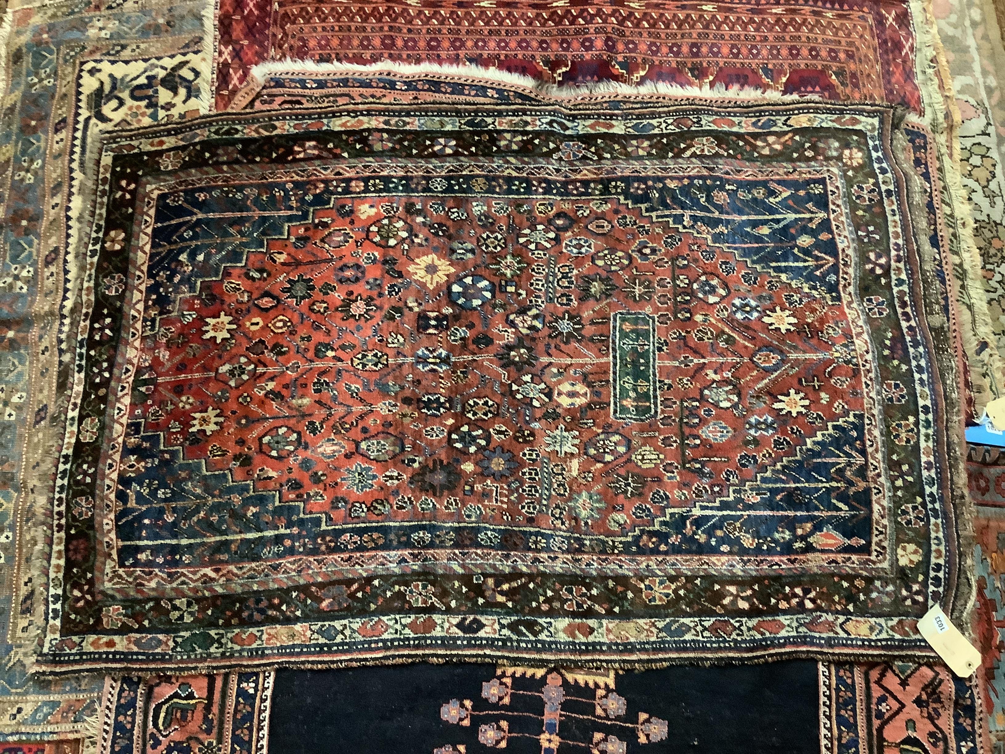 A Kashgai red ground rug, 169 x 109cm
